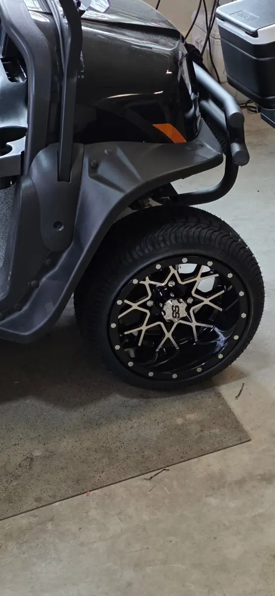 Close-up of a custom golf cart wheel and tire