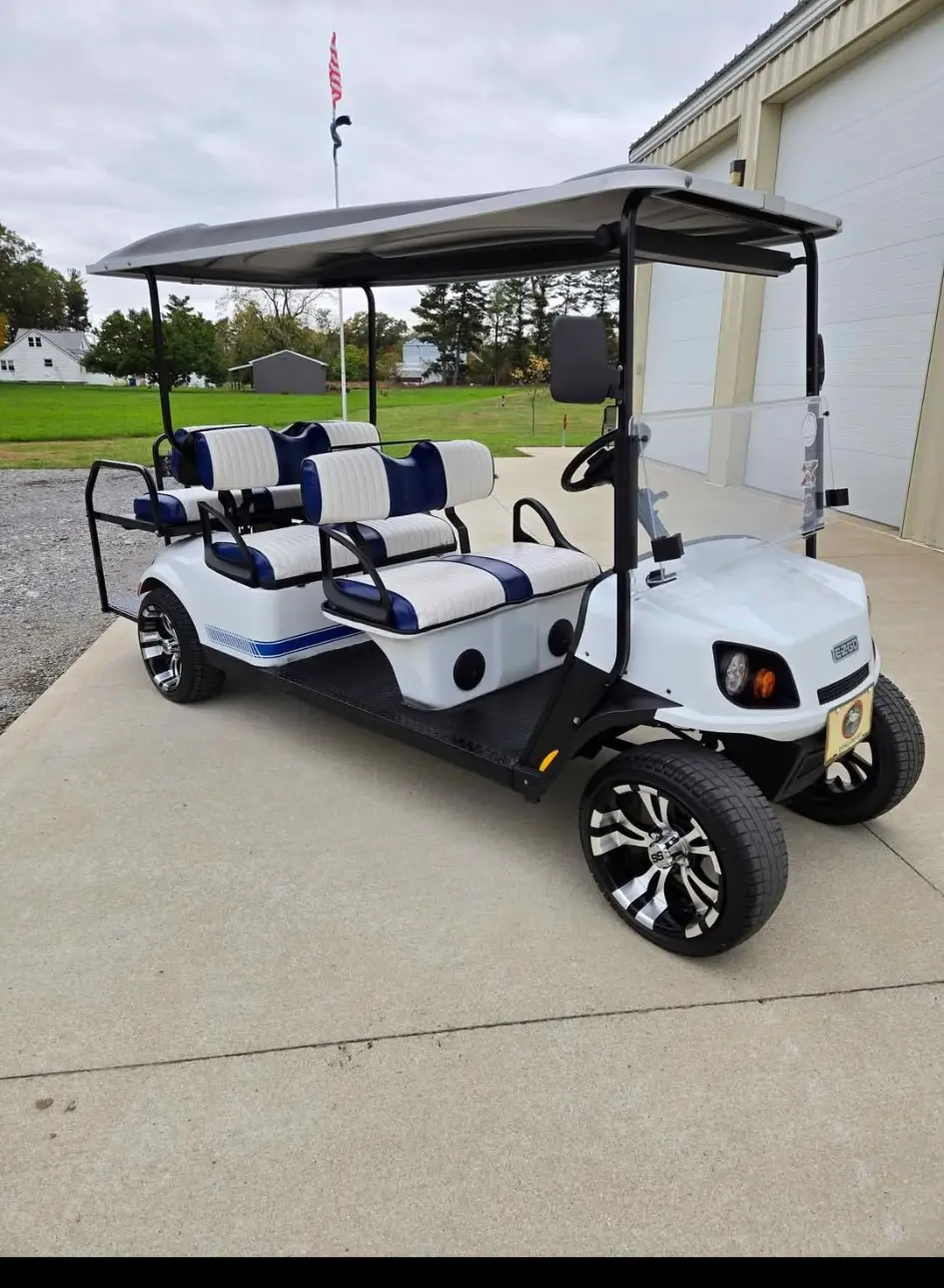 White six-passenger golf cart serviced by Jim’s Cart Care